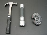 The hammer and flashlight and robot used in the experiment